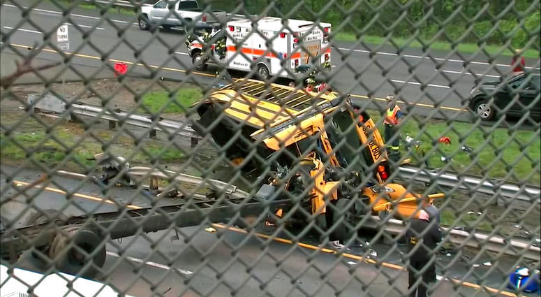 An overturned school bus after it collided with a dump truck, injuring multiple people, on Interstate 80 in Mount Olive, N.J. An overturned school bus after it collided with a dump truck, injuring multiple people, on Interstate 80 in Mount Olive, N.J.