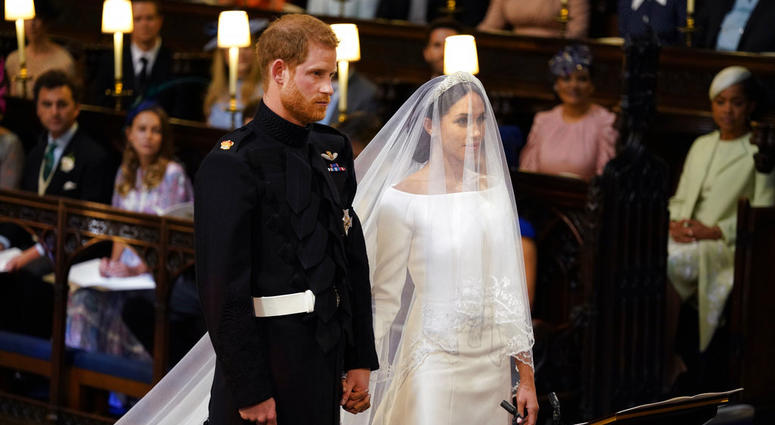 Britain's Prince Harry and Meghan Markle stand, prior to the start of their wedding ceremony, at St. George's Chapel in Windsor Castle in Windsor, near London, England, Saturday, May 19, 2018. Royal Wedding