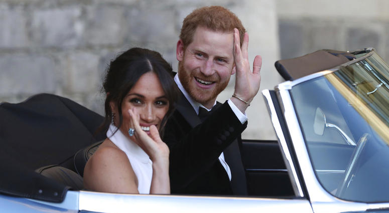 The newly married Duke and Duchess of Sussex, Meghan Markle and Prince Harry, leave Windsor Castle in a convertible car after their wedding. Meghan Markle and Prince Harry