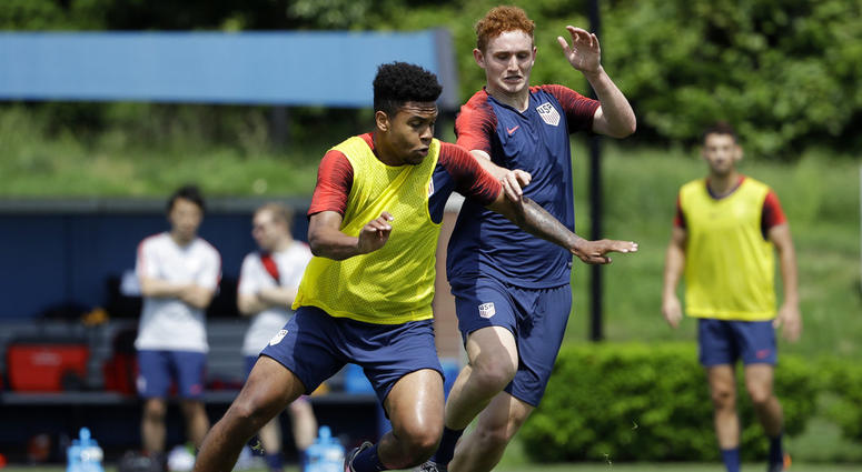 United States' Weston McKennie, left, and Josh Sargent battle for the ball during soccer practice at the University of Pennsylvania. United States' Weston McKennie, left, and Josh Sargent battle for the ball during soccer practice at the University of Pennsylvania.