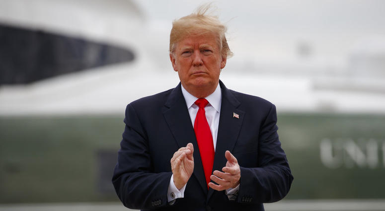 President Donald Trump boards Air Force One for a trip to New York to discuss immigration policy. President Donald Trump boards Air Force One for a trip to New York to discuss immigration policy.