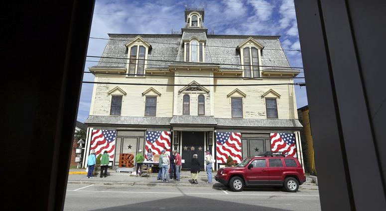 In this Sept. 13, 2014, file photo, fans gather outside "Star of Hope" the residence of artist Robert Indiana on Vinalhaven Island, Maine. Indiana died on May 19, 2018. Robert Indiana's Home