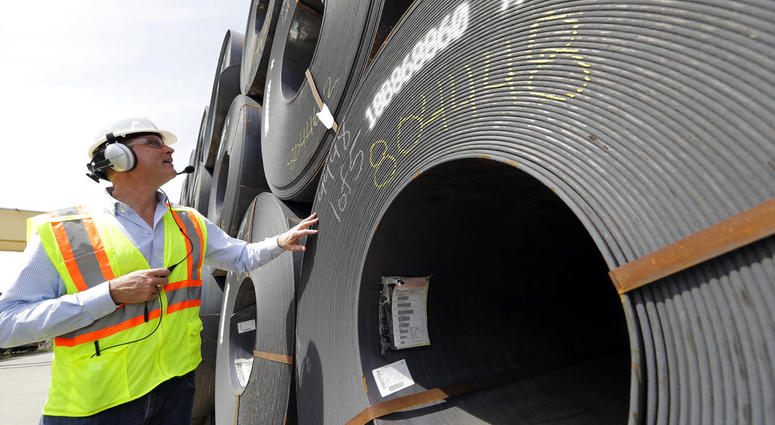 CEO Joel Johnson checks the details on a roll of steel at the Borusan Mannesmann Pipe manufacturing facility. CEO Joel Johnson checks the details on a roll of steel at the Borusan Mannesmann Pipe manufacturing facility.