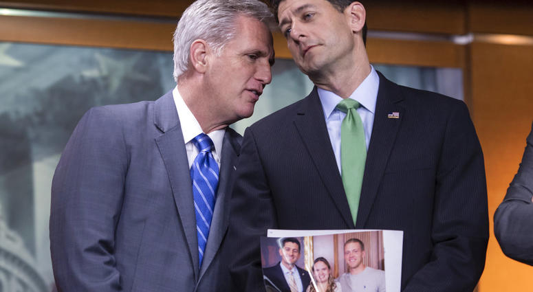 House Majority Leader Kevin McCarthy (left) and Speaker of the House Paul Ryan confer during a news conference. Ryan is holding a photo of a Wisconsin family which he referred to later while discussing the war on opioid addiction. House Majority Leader Kevin McCarthy (left) and Speaker of the House Paul Ryan confer during a news conference. Ryan is holding a photo of a Wisconsin family which he referred to later while discussing the war on opioid addiction.