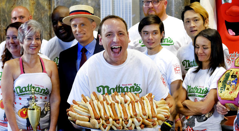 Ten-time and defending Nathan's Famous Men's Champion Joey Chestnut poses with 72 hot dogs during Nathan's Famous International Fourth of July Hot Dog Eating Contest weigh-in at the Empire State Building on Tuesday, July 3, 2018, in New York. Ten-time and defending Nathan's Famous Men's Champion Joey Chestnut poses with 72 hot dogs during Nathan's Famous International Fourth of July Hot Dog Eating Contest weigh-in at the Empire State Building on Tuesday, July 3, 2018, in New York.