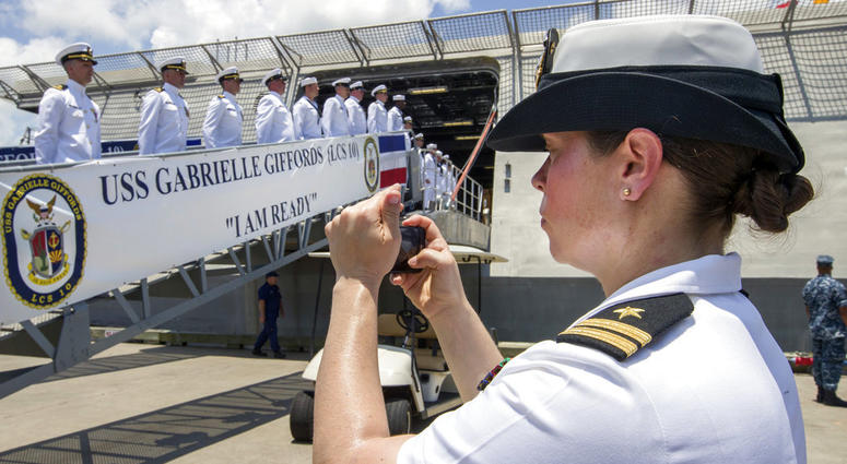In this June 10, 2017 file photo, U.S. Navy Lt. Miranda Williams photographs sailors as they board the USS Gabrielle Giffords during a commissioning ceremony in Galveston, Texas. In this June 10, 2017 file photo, U.S. Navy Lt. Miranda Williams photographs sailors as they board the USS Gabrielle Giffords during a commissioning ceremony in Galveston, Texas.