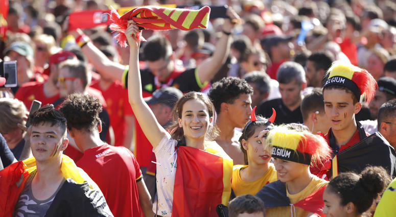 Belgium soccer fan reacts as they watch a 2018 World Cup soccer match between Belgium and England on a giant screen in Jette, Belgium. Belgium soccer fan reacts as they watch a 2018 World Cup soccer match between Belgium and England on a giant screen in Jette, Belgium.