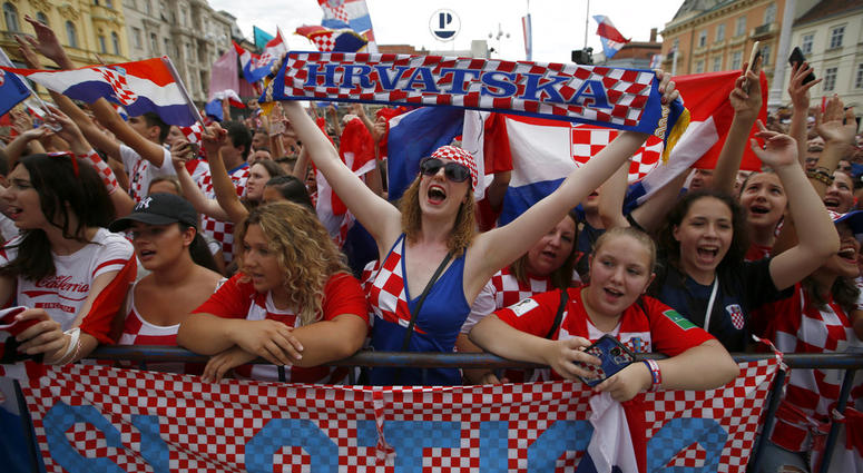 Supporter of Croatia national soccer team members wait to welcome the team on their arrival in Zagreb, Croatia. Supporter of Croatia national soccer team members wait to welcome the team on their arrival in Zagreb, Croatia.