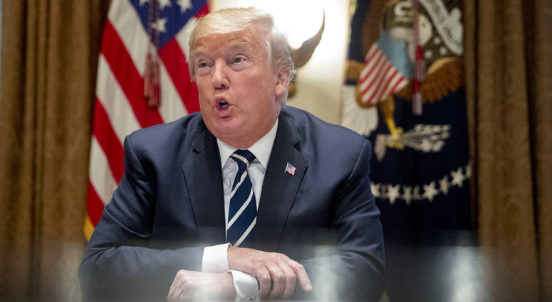 President Donald Trump speaks to members of the media as he meets with members of Congress in the Cabinet Room of the White House, Tuesday, July 17, 2018, in Washington.