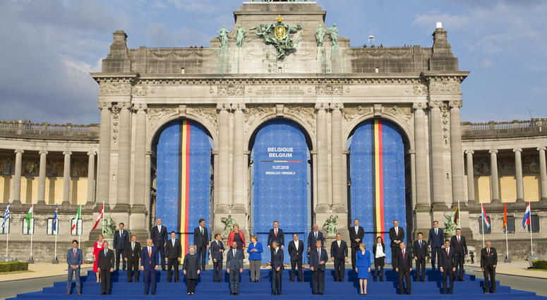 In this July 11, 2018, photo, President Donald Trump on stage during a group photo of NATO heads of state and government at Park Cinquantenaire in Brussels, Belgium. In this July 11, 2018, photo, President Donald Trump on stage during a group photo of NATO heads of state and government at Park Cinquantenaire in Brussels, Belgium.