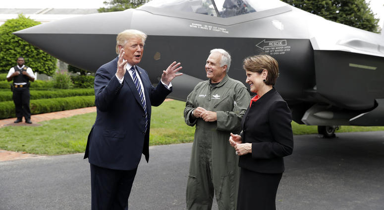 President Donald Trump talks with Lockheed Martin president and CEO Marilyn Hewson and director and chief test pilot Alan Norman in front of a F-35 as he participates in a "Made in America Product Showcase" at the White House. President Donald Trump talks with Lockheed Martin president and CEO Marilyn Hewson and director and chief test pilot Alan Norman in front of a F-35 as he participates in a "Made in America Product Showcase" at the White House.