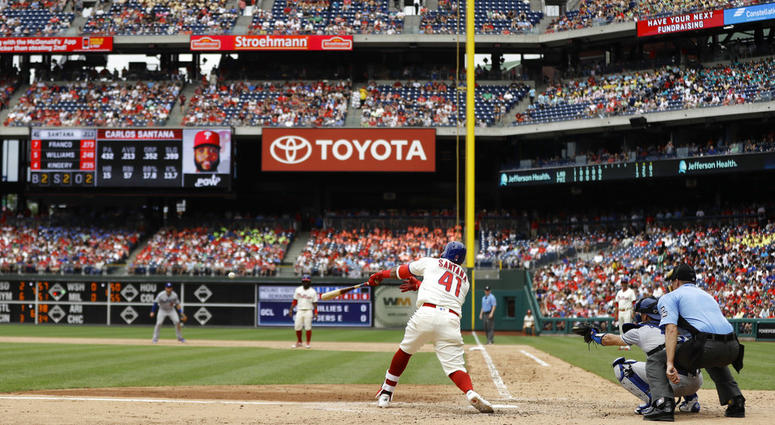Philadelphia Phillies' Carlos Santana hits a three-run triple off Los Angeles Dodgers relief pitcher Scott Alexander during the fifth inning of a baseball game, Wednesday, July 25, 2018, in Philadelphia. Philadelphia Phillies' Carlos Santana hits a three-run triple off Los Angeles Dodgers relief pitcher Scott Alexander during the fifth inning of a baseball game, Wednesday, July 25, 2018, in Philadelphia.