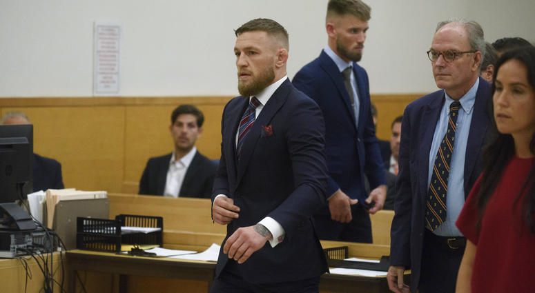 Mixed martial arts fighters Conor McGregor, center, and co-defendant Cian Cowley, third from left, appear in court, Thursday, July 26, 2018, in New York. Conor McGregor
