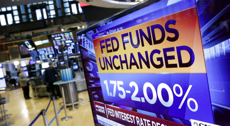A screen on the floor of the New York Stock Exchange shows the rate decision of the Federal Reserve, Wednesday, Aug. 1, 2018. A screen on the floor of the New York Stock Exchange shows the rate decision of the Federal Reserve, Wednesday, Aug. 1, 2018.