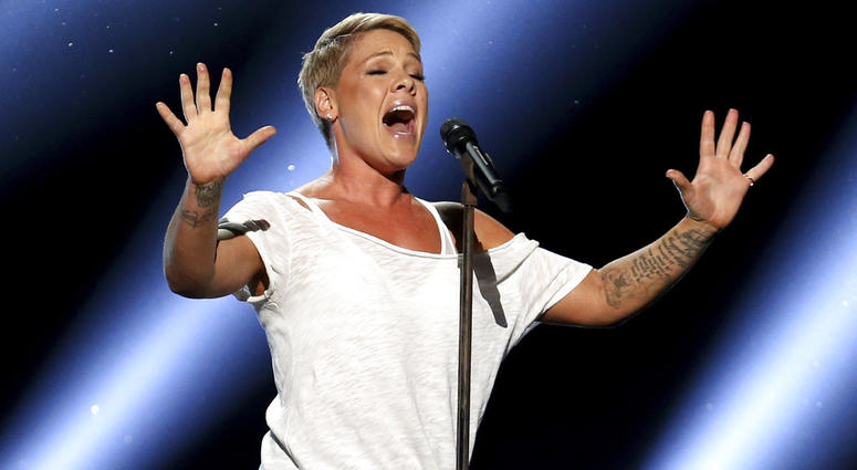 In this Jan. 28, 2018, file photo, Pink performs "Wild Hearts Can't Be Broken" at the 60th annual Grammy Awards at Madison Square Garden in New York. Pink