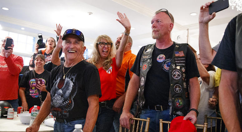 Supporters and members of Bikers for Trump wave and cheer, Saturday, Aug. 11, 2018, in the ballroom of Trump National Golf Club in Bedminster, N.J, during a meeting with President Donald Trump. Supporters and members of Bikers for Trump wave and cheer, Saturday, Aug. 11, 2018, in the ballroom of Trump National Golf Club in Bedminster, N.J, during a meeting with President Donald Trump.