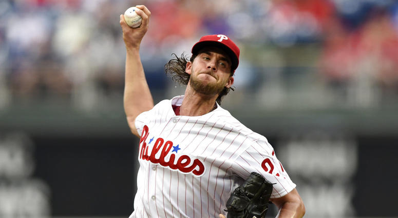 Philadelphia Phillies starting pitcher Aaron Nola throws during the first inning of a baseball game against the New York Mets. Aaron Nola