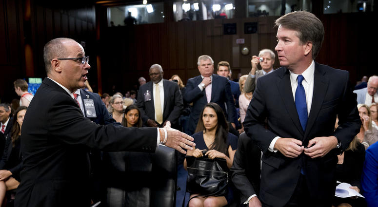 Fred Guttenberg, the father of Jamie Guttenberg who was killed in the Stoneman Douglas High School shooting in Parkland, Fla., left, attempts to shake hands with Brett Kavanaugh, right, as he leaves for a lunch break. Fred Guttenberg, the father of Jamie Guttenberg who was killed in the Stoneman Douglas High School shooting in Parkland, Fla., left, attempts to shake hands with Brett Kavanaugh, right, as he leaves for a lunch break.