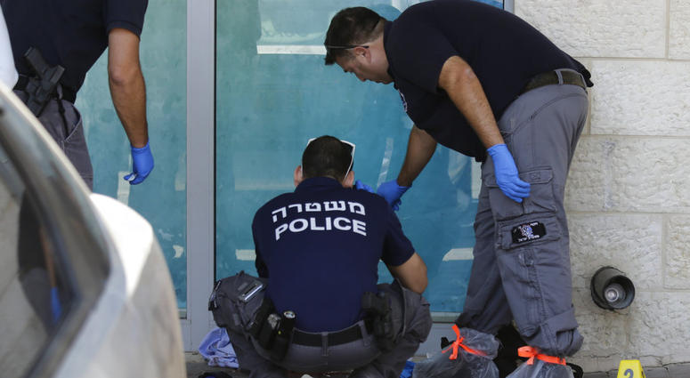 Israeli police investigates at the scene of an stabbing attack in the West Bank settlement of Gush Etzion Sunday, Sept. 15, 2018. Israeli police investigates at the scene of an stabbing attack in the West Bank settlement of Gush Etzion Sunday, Sept. 15, 2018.