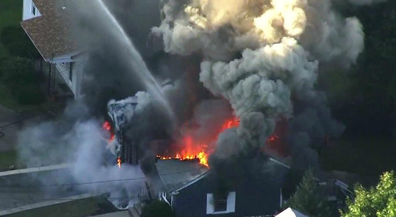 In this Sept. 13, 2018, file image take from video provided by WCVB in Boston, flames consume the roof of a home in Lawrence, Mass, a suburb of Boston. In this Sept. 13, 2018, file image take from video provided by WCVB in Boston, flames consume the roof of a home in Lawrence, Mass, a suburb of Boston.