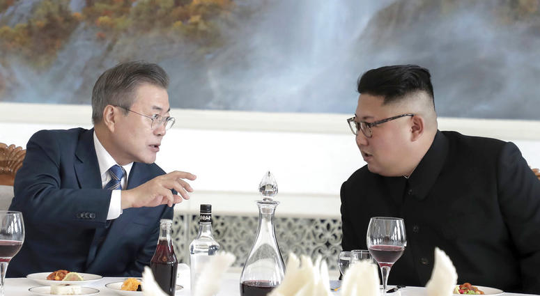 South Korean President Moon Jae-in, left, talks with North Korean leader Kim Jong Un at Okryu-Gwan restaurant in Pyongyang, North Korea, Wednesday, Sept. 19, 2018. South Korean President Moon Jae-in, left, talks with North Korean leader Kim Jong Un.