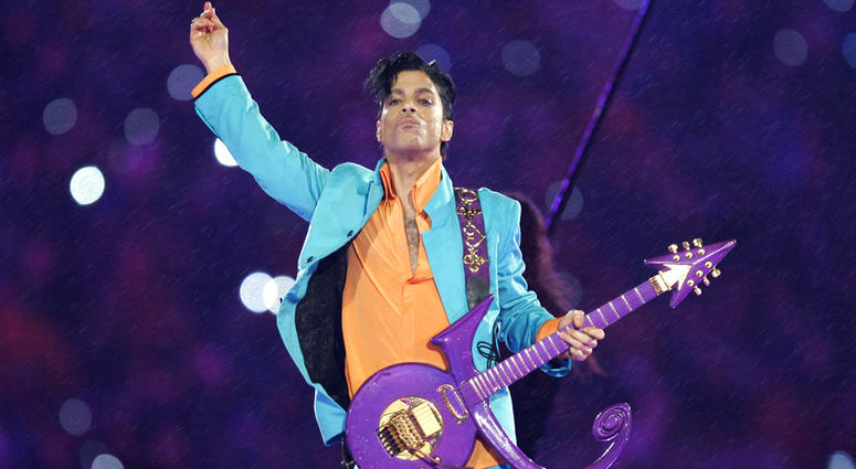 In this Feb. 4, 2007, file photo, Prince performs during the halftime show at the Super Bowl XLI football game at Dolphin Stadium in Miami. Prince