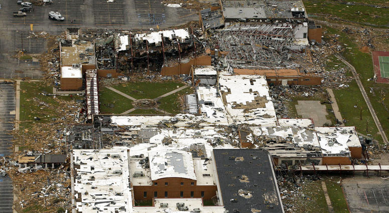 This May 24, 2011, file photo shows the damage to Joplin High School in Joplin, Mo., after a tornado swept through the area. Hurricane Florence