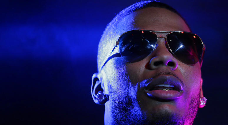 In this April 18, 2015, file photo, rapper Nelly performs on stage during a Corner Block Party concert at Auburn University in Auburn, Ala. Nelly