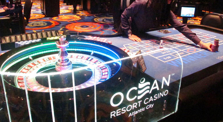 A dealer pushes a stack of chips toward a gambler at the Ocean Resort Casino in Atlantic City N.J. Ocean Casino