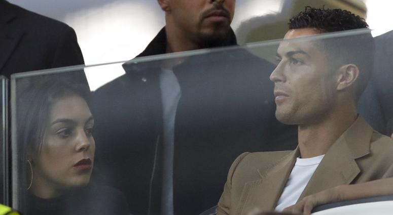 Juventus forward Cristiano Ronaldo and his partner Georgina sit in the stands prior to the Champions League, group H soccer match between Juventus and Young Boys, at the Allianz stadium in Turin, Italy, Tuesday, Oct. 2, 2018. Cristiano Ronaldo
