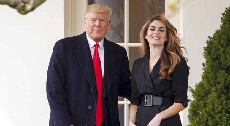 In this March 29, 2018, file photo, President Donald Trump poses for members of the media with then White House Communications Director Hope Hicks on her last day before he boards Marine One on the South Lawn of the White House in Washington. President Donald Trump poses for members of the media with then White House Communications Director Hope Hicks.