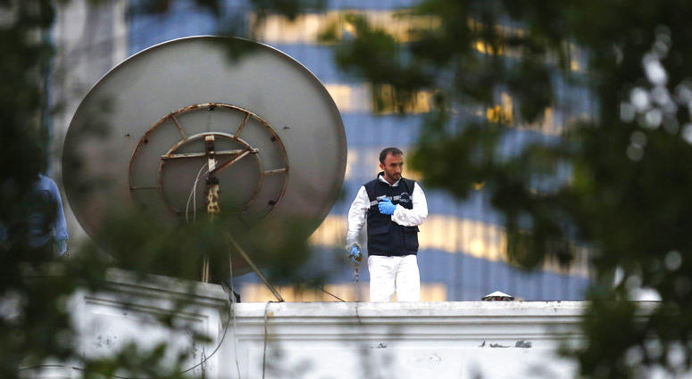 A Turkish police officer stands on the roof of the residence of the Saudi consul General Mohammed al-Otaibi as Turkish police conducted a search after the disappearance and alleged slaying of writer Jamal Khashoggi, in Istanbul, Wednesday, Oct. 17, 2018.