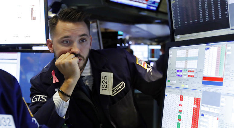 Specialist Matthew Grenier works on the floor of the New York Stock Exchange, Tuesday, Oct. 23, 2018. Specialist Matthew Grenier works on the floor of the New York Stock Exchange, Tuesday, Oct. 23, 2018.
