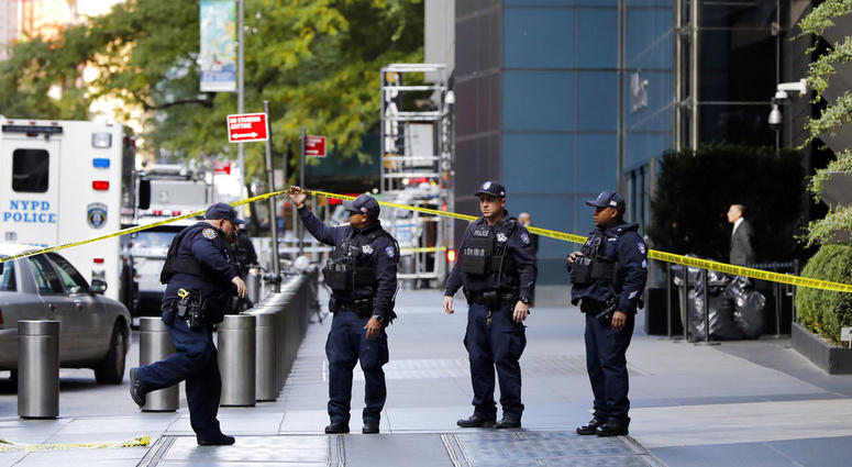 New York City Police Dept. officers arrive outside the Time Warner Center, in New York, Wednesday, Oct. 24, 2018. A police bomb squad was sent to CNN's offices in New York City and the newsroom was evacuated because of a suspicious package. (AP Photo/Rich Pipe bombs target Democrats