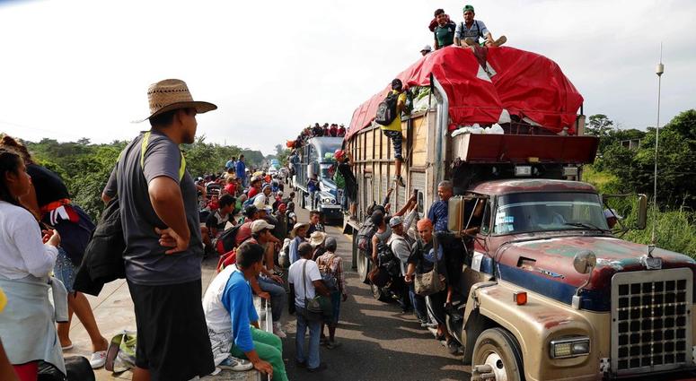 Central American migrants, part of the caravan hoping to reach the U.S. border, get a ride on trucks, in Donaji, Oaxaca state, Mexico, Friday, Nov. 2, 2018. Migrant Caravan
