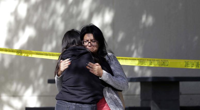 Mourners embrace outside of the Thousand Oaks Teen Center on Thursday, Nov. 8, 2018, where relatives and friends gathered in the aftermath of the Wednesday night mass shooting, in Thousand Oaks, Calif. California Bar Shooting