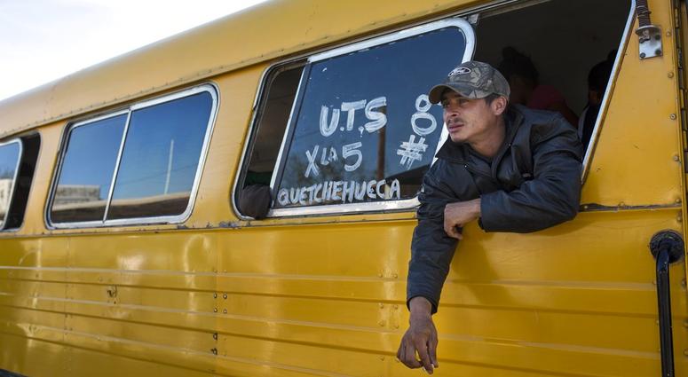 A Central American migrant, part of the caravan hoping to reach the U.S. border, smokes during a stop at a check point in San Luis Rio Colorado in their way to Tijuana, Baja California state, Mexico, Thursday, Nov. 15, 2018. A Central American migrant, part of the caravan hoping to reach the U.S. border, smokes during a stop at a check point in San Luis Rio Colorado in their way to Tijuana, Baja California state, Mexico, Thursday, Nov. 15, 2018.