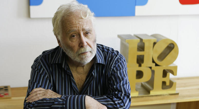 In this Aug. 29, 2009, file photo, artist Robert Indiana poses at his studio in Vinalhaven, Maine. Robert Indiana