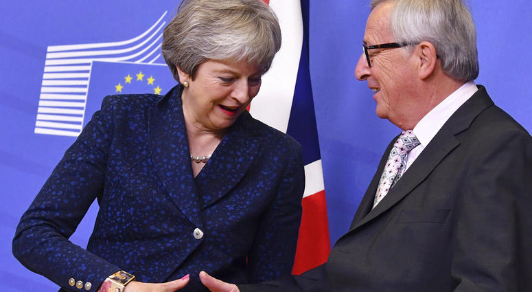 European Commission President Jean-Claude Juncker, right, shakes hands with British Prime Minister Theresa May prior to a meeting at EU headquarters in Brussels, Saturday, Nov. 24, 2018. European Commission President Jean-Claude Juncker, right, shakes hands with British Prime Minister Theresa May prior to a meeting at EU headquarters in Brussels, Saturday, Nov. 24, 2018.