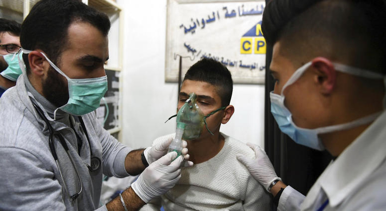 In this photo released by the Syrian official news agency SANA, shows a man receiving oxygen through respirators following a suspected chemical attack on his town of al-Khalidiya, in Aleppo, Syria, Saturday, Nov. 24, 2018 In this photo released by the Syrian official news agency SANA, shows a man receiving oxygen through respirators following a suspected chemical attack on his town of al-Khalidiya, in Aleppo, Syria, Saturday, Nov. 24, 2018