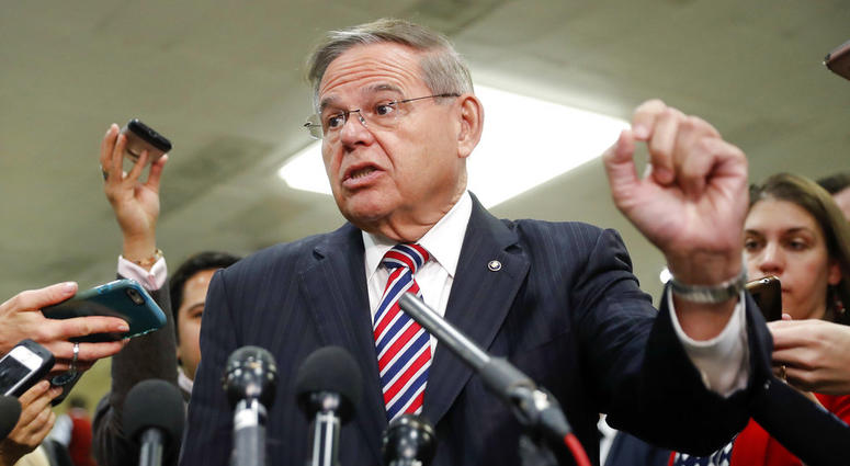 Sen. Bob Menendez, D-N.J., speaks to members of the media after leaving a closed door meeting about Saudi Arabia with Secretary of State Mike Pompeo, Nov. 28, 2018, on Capitol Hill in Washington. Sen. Bob Menendez speaks to members of the media.