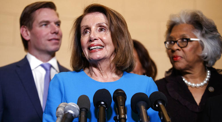 House Minority Leader Nancy Pelosi, joined by Rep. Eric Swalwell (left), and Rep. Joyce Beatty, speaks to media at Longworth House Office Building on Capitol Hill, Nov. 28, 2018, to announce her nomination by House Dems to lead them in the new Congress. House Minority Leader Nancy Pelosi, joined by Rep. Eric Swalwell (left), and Rep. Joyce Beatty, speaks to media at Longworth House Office Building on Capitol Hill, Nov. 28, 2018, to announce her nomination by House Dems to lead them in the new Congress.
