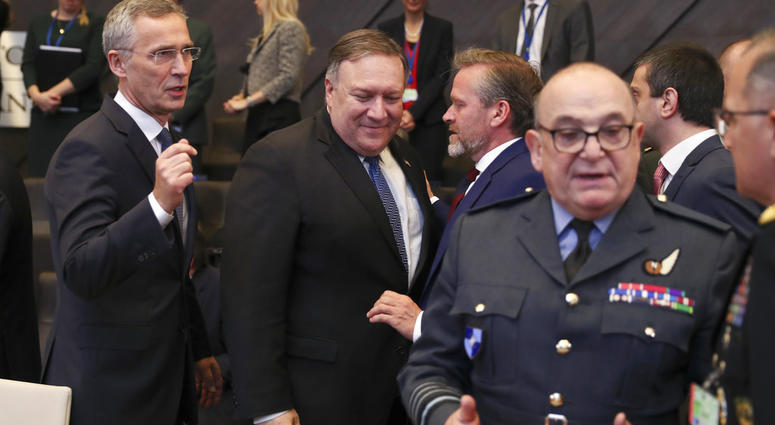 U.S. Secretary of State Mike Pompeo, center, and NATO Secretary General Jens Stoltenberg, right, arrive for a round table meeting of the North Atlantic Council with Georgia and Ukraine at NATO headquarters in Brussels, Tuesday, Dec. 4, 2018. U.S. Secretary of State Mike Pompeo, center, and NATO Secretary General Jens Stoltenberg, right, arrive for a round table meeting of the North Atlantic Council with Georgia and Ukraine at NATO headquarters in Brussels, Tuesday, Dec. 4, 2018.