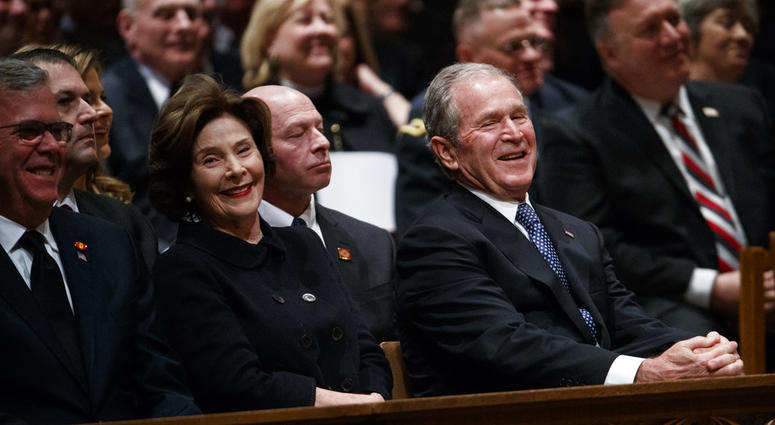 Jeb Bush, Laura Bush, and former President George W. Bush share a laugh as a story is told about former President George H.W. Bush during a State Funeral at the National Cathedral, Wednesday, Dec. 5, 2018, in Washington. Jeb Bush, Laura Bush, and former President George W. Bush share a laugh as a story is told about former President George H.W. Bush during a State Funeral at the National Cathedral, Wednesday, Dec. 5, 2018, in Washington.