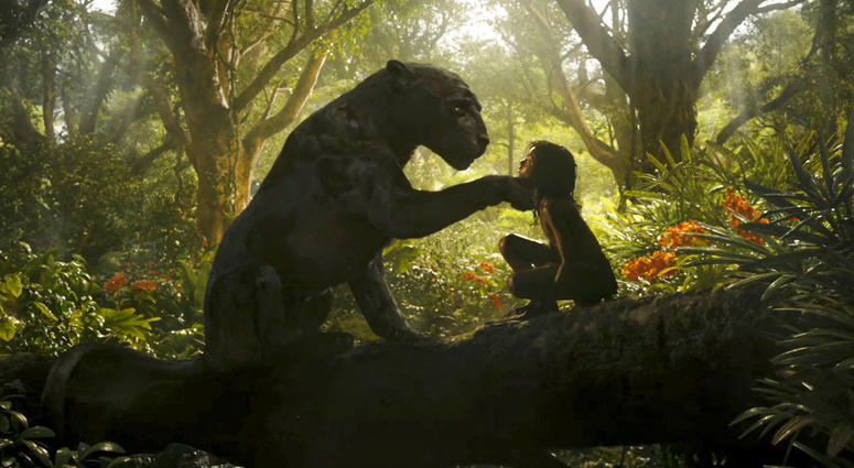 This image released by Netflix shows Rohan Chand as Mowgli, right, and the character Bagheera, voiced by Christian Bale, in a scene from the film, "Mowgli: Legend of the Jungle," streaming on Netflix on Friday. This image released by Netflix shows Rohan Chand as Mowgli, right, and the character Bagheera, voiced by Christian Bale, in a scene from the film, "Mowgli: Legend of the Jungle," streaming on Netflix on Friday.