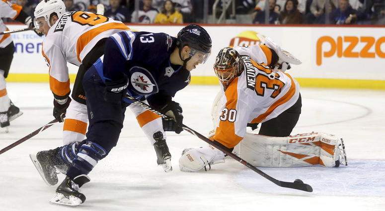 Winnipeg Jets' Brandon Tanev (13) scores against Philadelphia Flyers' goaltender Michal Neuvirth (30) after getting past Flyers' Ivan Provorov (9) during second-period NHL hockey game action in Winnipeg, Manitoba, Sunday, Dec. 9, 2018. Winnipeg Jets' Brandon Tanev (13) scores against Philadelphia Flyers' goaltender Michal Neuvirth (30) after getting past Flyers' Ivan Provorov (9) during second-period NHL hockey game action in Winnipeg, Manitoba, Sunday, Dec. 9, 2018.