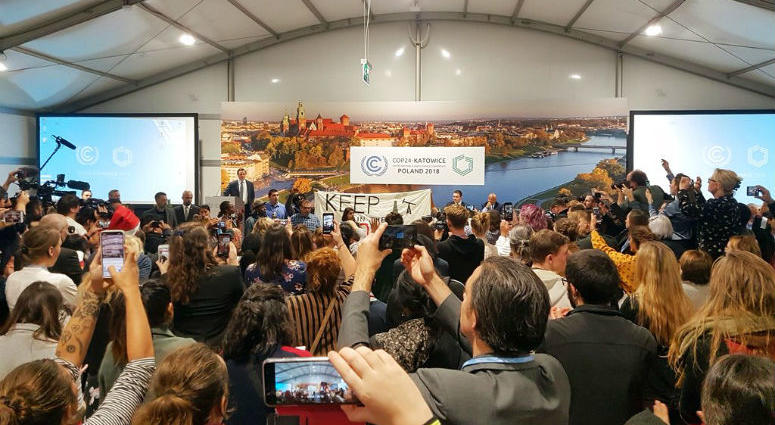 Youth and indigenous groups protest against fossil fuels during US-hosted event at the UN climate talks in Katowice, Poland, Monday, Dec. 10, 2018, as the COP24 UN Climate Change Conference takes place in the city. Youth and indigenous groups protest against fossil fuels during US-hosted event at the UN climate talks in Katowice, Poland, Monday, Dec. 10, 2018, as the COP24 UN Climate Change Conference takes place in the city.