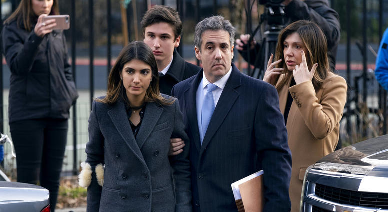 Michael Cohen, right, President Donald Trump's former lawyer, accompanied by his children and wife, arrive at federal court for his sentencing for dodging taxes, lying to Congress and violating campaign finance laws in New York on Dec. 12, 2018. Michael Cohen, right, President Donald Trump's former lawyer, accompanied by his children and wife, arrive at federal court for his sentencing for dodging taxes, lying to Congress and violating campaign finance laws in New York on Dec. 12, 2018.