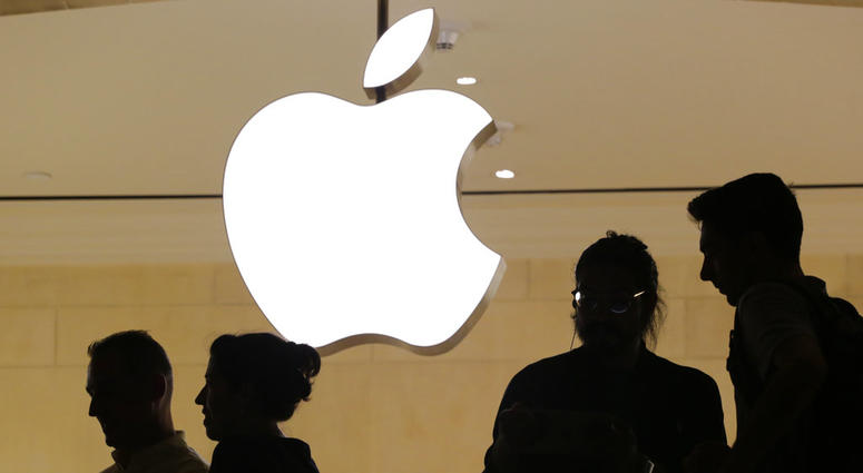 In this May 31, 2018, file photo, customers enter the Apple store, in New York. Customers enter the Apple store in New York.