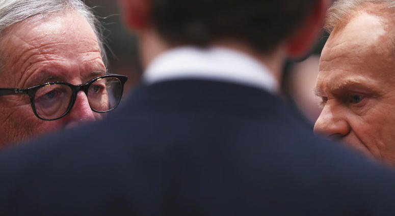 European Commission President Jean-Claude Juncker, left, and European Council President Donald Tusk, right, speak with Austrian Chancellor Sebastian Kurz during a round table meeting at an EU summit in Brussels, Friday, Dec. 14, 2018. European Commission President Jean-Claude Juncker, left, and European Council President Donald Tusk, right, speak with Austrian Chancellor Sebastian Kurz during a round table meeting at an EU summit in Brussels, Friday, Dec. 14, 2018.